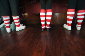 Three legs wearing red & white striped socks