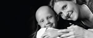 mom hugging son with cancer